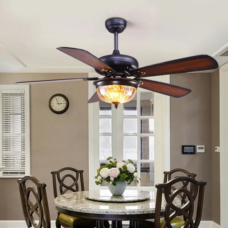 Dark bronze tiffany ceiling fan with five wooden blades and warm-toned glass ceiling fan light for living room