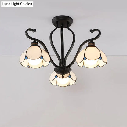 Black wrought iron DecorBites™ semi-flush mount chandelier with three cream and blue stained glass flower shades for living room lighting