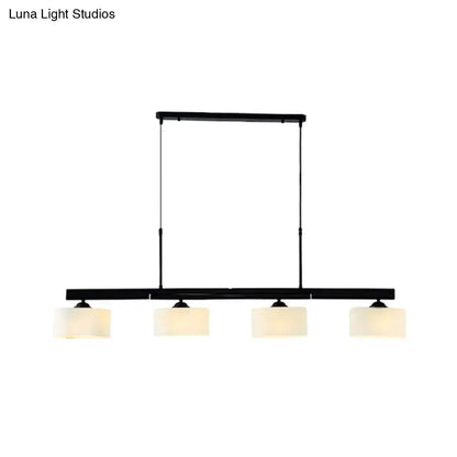 Black metal traditional drum island pendant light with four frosted white glass shades for dining room