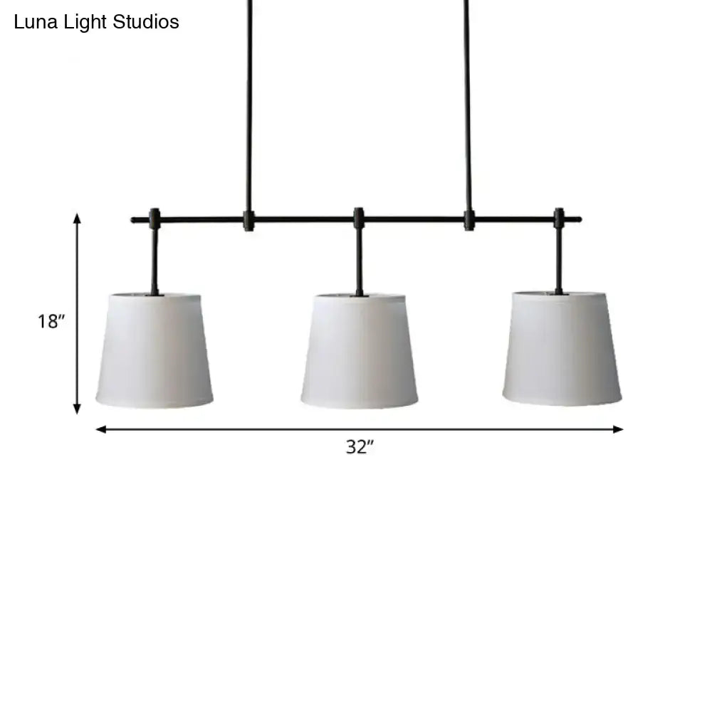 Traditional black metal pendant lighting with three white fabric shades suitable for dining room barrel island light