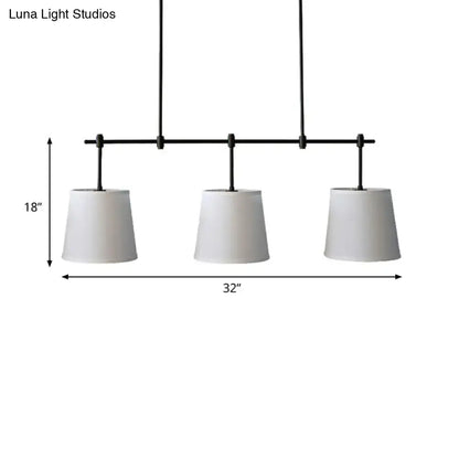 Traditional black metal pendant lighting with three white fabric shades suitable for dining room barrel island light