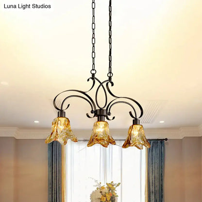 Antique bronze wrought iron chandelier with three amber glass bell shades for dining room black island lamp lighting