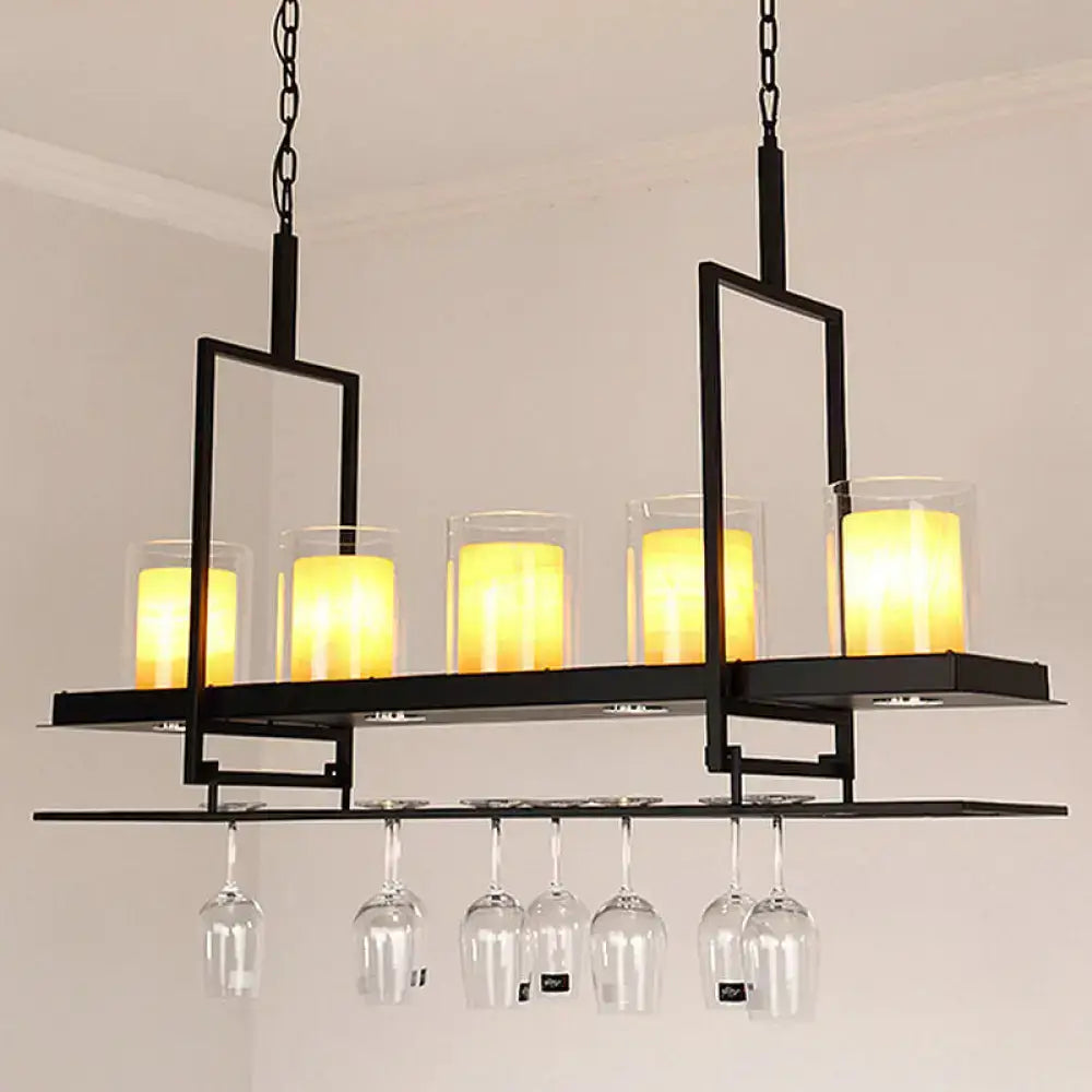 Black metal chandelier with five glowing candle lights and metal wine glass rack in traditional black marble finish