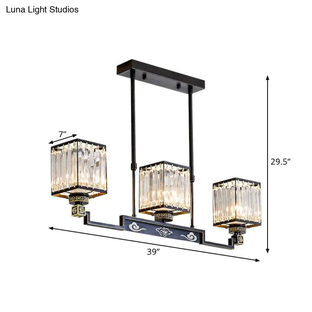 Black metal crystal island chandelier with three rectangular shades and ornate cloud motifs for traditional dining rooms
