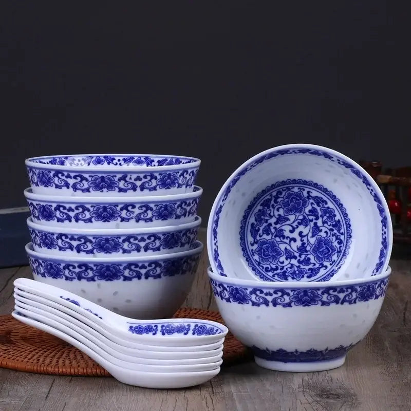 Set of six white porcelain dragon rice bowls with intricate blue floral patterns and matching spoons for dining use