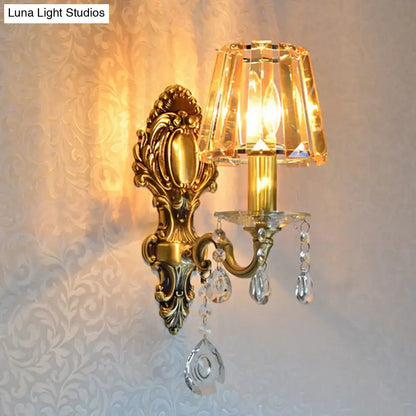 Traditional brass wall lamp with gold-toned ornate design and clear crystal shade for 220v-240v 110v-120v use