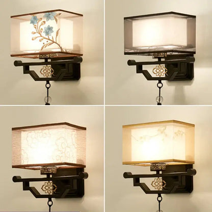 Traditional bronze floral elegant fabric wall lamp with dark bronze frame and embroidered beige and blue shade for bedroom lighting