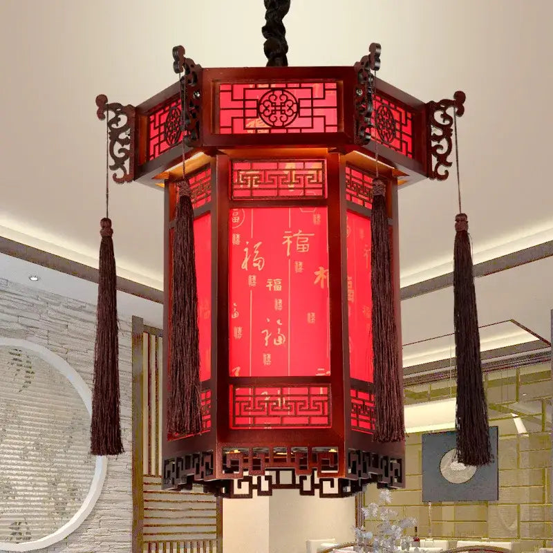 Red traditional Chinese bamboo lantern pendant light with intricate wood framing and golden calligraphy for dining room decorbites bamboo lantern