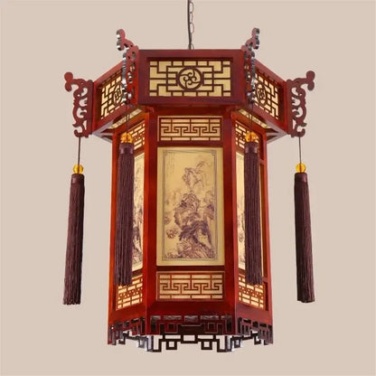Traditional chinese red wooden bamboo lantern pendant light with intricate lattice work and hanging tassels for dining room decor