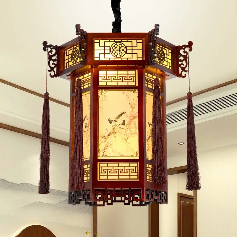 Traditional chinese carved bamboo lantern pendant lights with reddish-brown frame and bird scenes for dining room use
