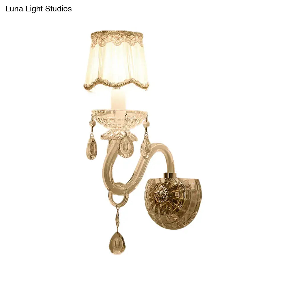 Elegant traditional gold crystal candle wall lamp with lace-trimmed cream shade and dangling teardrop crystals