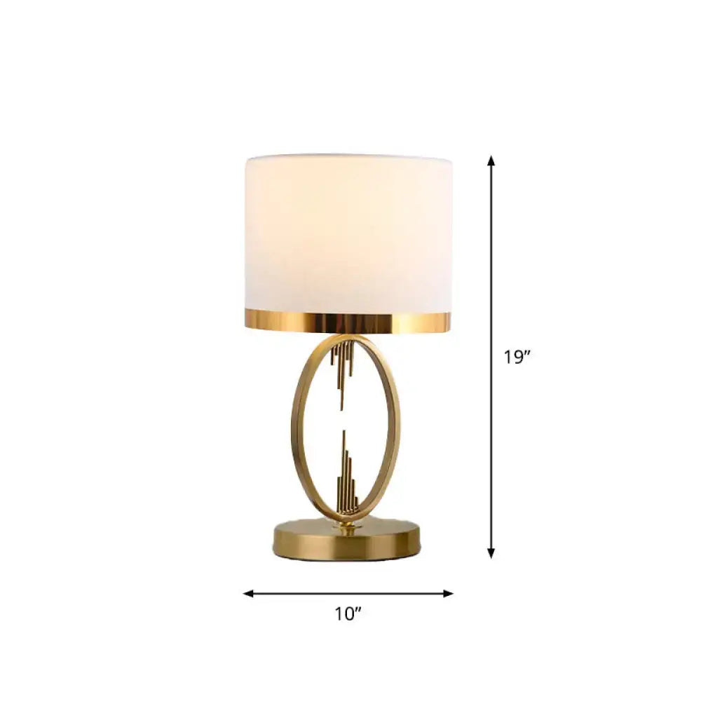 Decorbites traditional round fabric table light in brass with gold finish and white cylindrical shade for single living room use