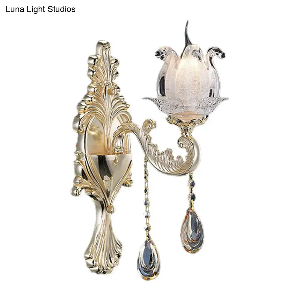 Traditional gold frosted glass sconce with ornate swan crystal motif and teardrop crystals for living room wall light