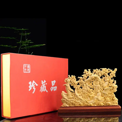 Elaborate golden-carved eight immortals sculpture on polished wooden base traditional ivory living room decor