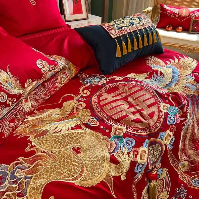 Traditional red satin bedding set with luxury gold loong embroidery featuring dragons phoenixes and double happiness symbol