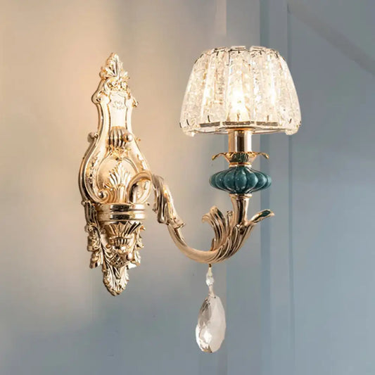 Traditional seedy crystal gold and teal drum wall mount bedroom sconce with ornate gold-toned wall sconce and crystal lampshade