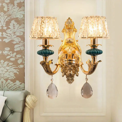 Gold-toned traditional seedy crystal drum wall mount bedroom sconce with crystal lampshades and teardrop crystals