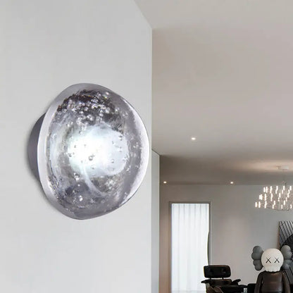 Traditional silver clear crystal bubble wall light 10 inches wide with a textured spherical design for bedroom use