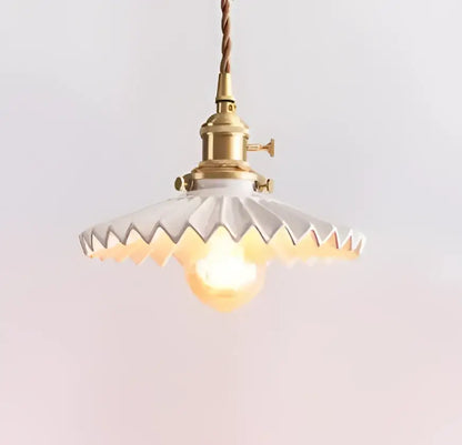 Vintage-style white scalloped glass pendant light with brass fixture hanging from twisted brown cord for decorbites blue glass pendant lights