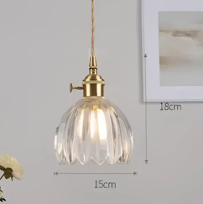 Vintage-style blue glass pendant light with brass fixture featuring faceted petal shade for dining room decorbites blue glass