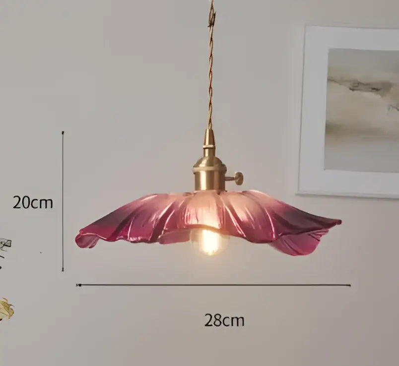 Delicate pink glass pendant light shaped like an open flower with brass fixture and twisted cord for decorbites blue glass pendant lights