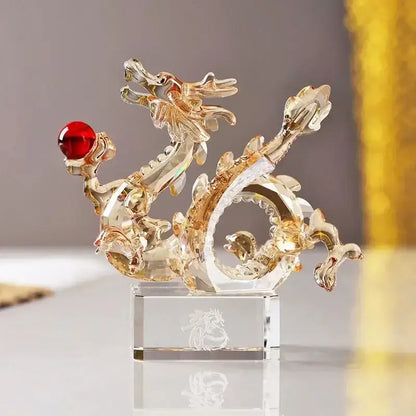 A translucent golden crystal dragon statue with a red gem for feng shui living room decor by decorbites