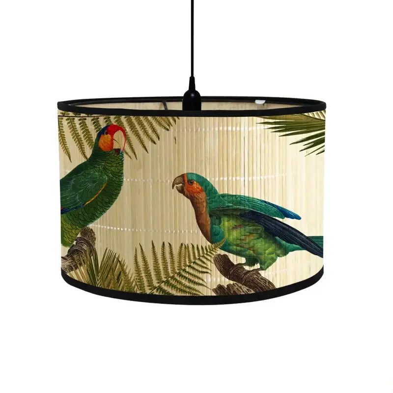 A cream-colored decorbites bamboo pendant light with a tropical bird print and fabric shade for dining room decor