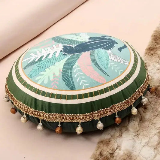 Round green ethnic print tassel cushion cover with tropical leaf and black bird design trimmed in gold chain for decorbites living room decor