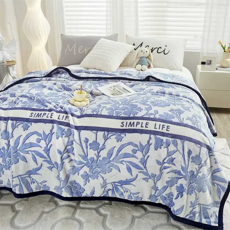 Tropical leaf light blue cozy flannel blanket with white and blue floral throw and navy border from decorbites cozy flannel