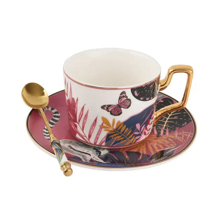 White ceramic tea cup set with gold trim and tropical pink butterfly design for dining room use
