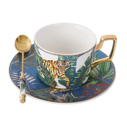 Porcelain tea cup set with gold rim and handle featuring a vibrant orange tiger jungle scene exterior for dining room