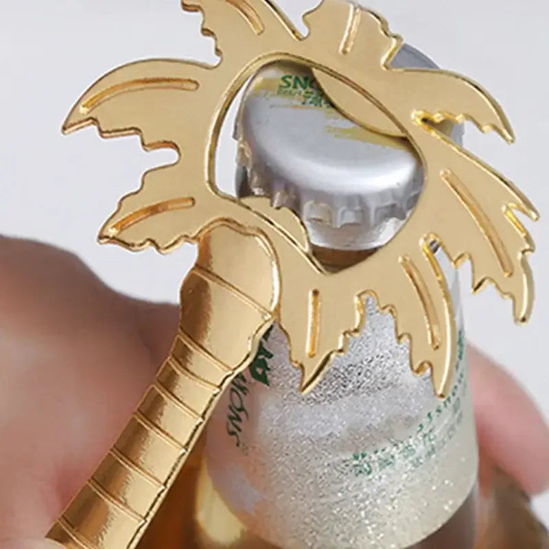 Gold palm tree-shaped coconut tree bottle opener with textured trunk and leaves by decorbites for kitchen use