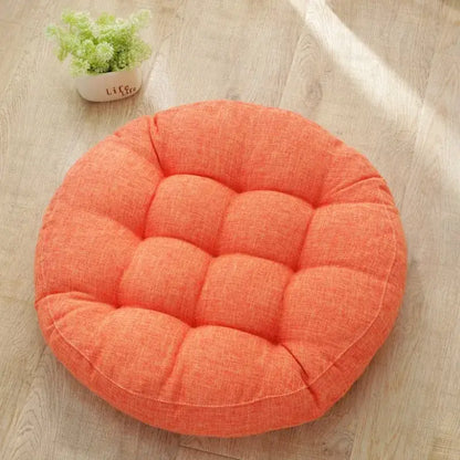Orangish-orange tufted kids round floor cushion with textured fabric surface for bedroom seating decorbites kids round
