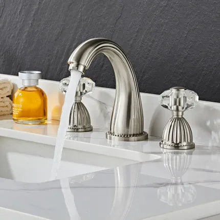 Stainless steel Tuqiu gold basin faucet with crystal knobs and curved spout for cold water in black widespread design