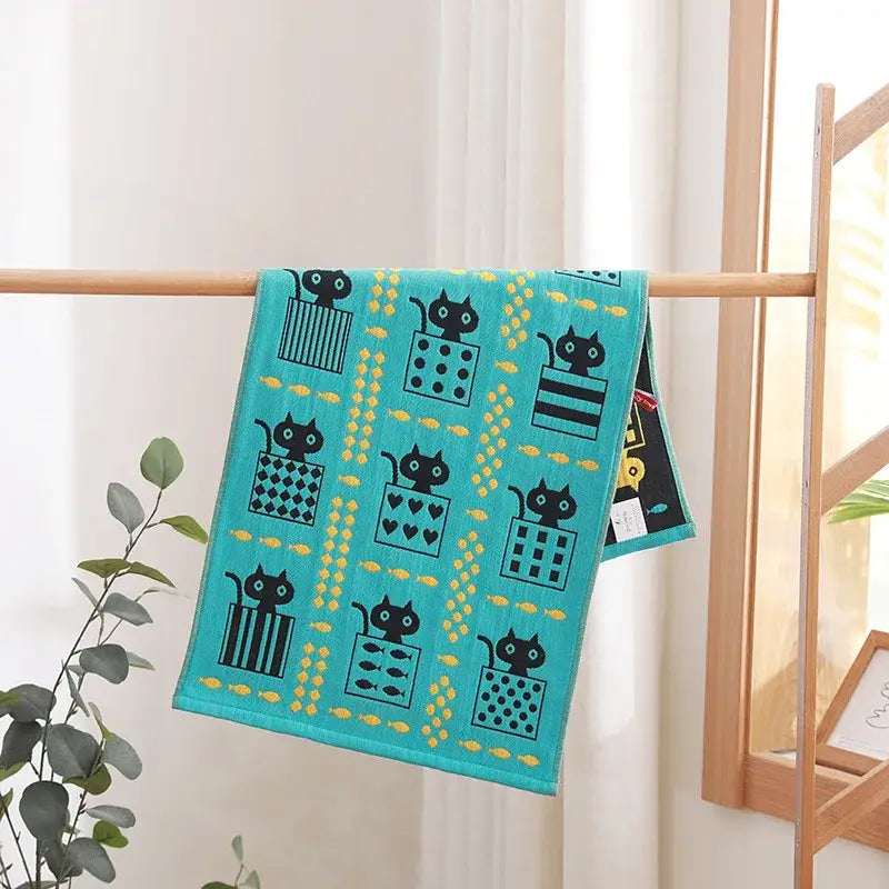 Turquoise cartoon cat cotton gauze face towel featuring playful black cats and yellow fish motifs for bathroom decorbites cotton gauze hand use