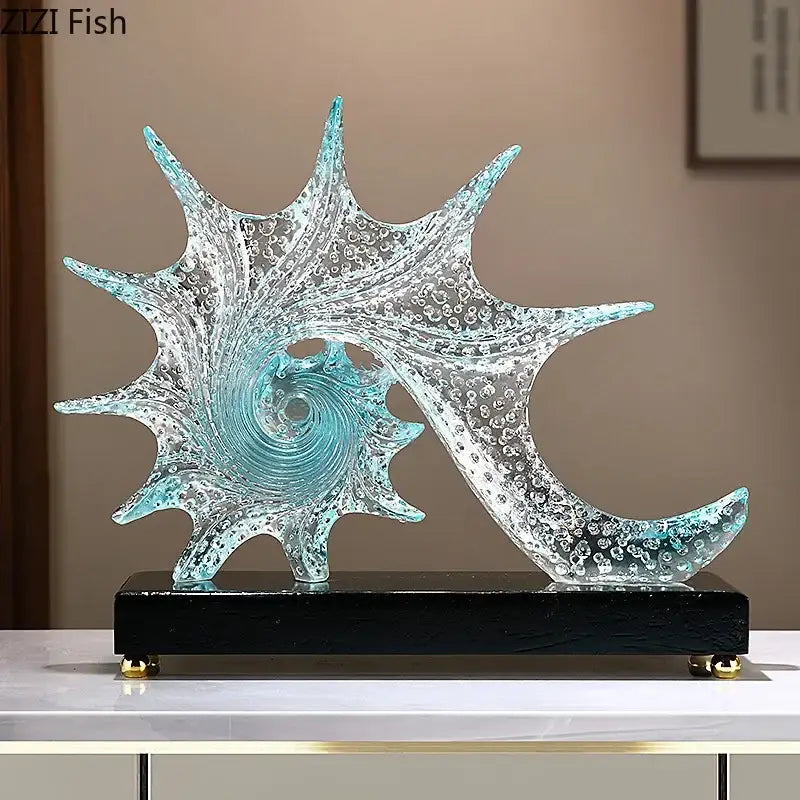 Turquoise and clear glass bubble conch sculpture with spiral design and embedded bubbles on black base for bedroom decor