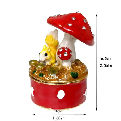 Red and white enamel trinket box with decorative mushroom and yellow squirrel figurine from decorbites crystal animal collection