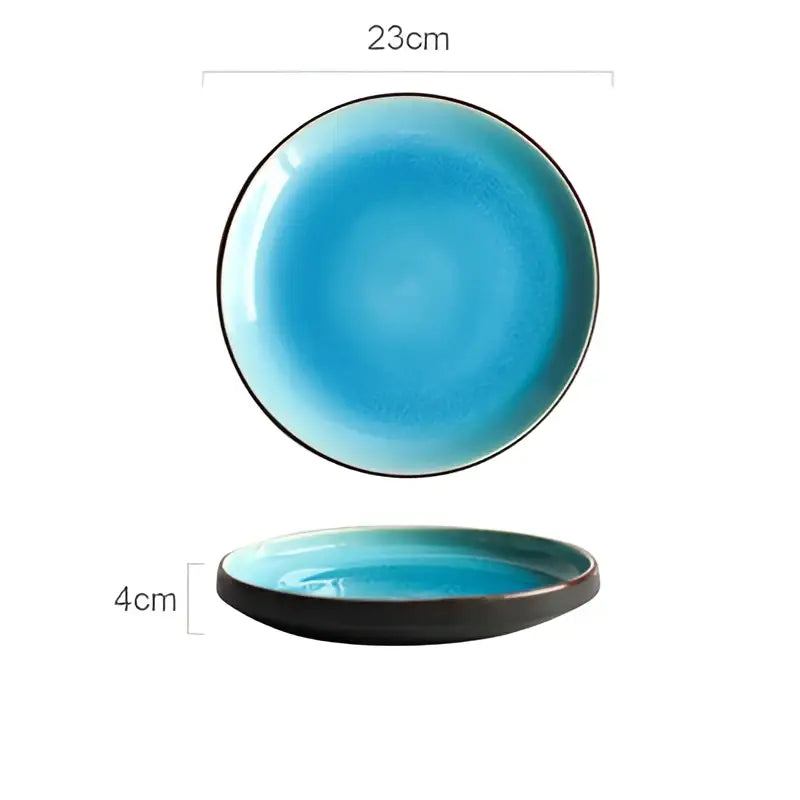 A 23cm ceramic plate with vibrant turquoise ice cracking glaze and black rim from a ceramic tableware set