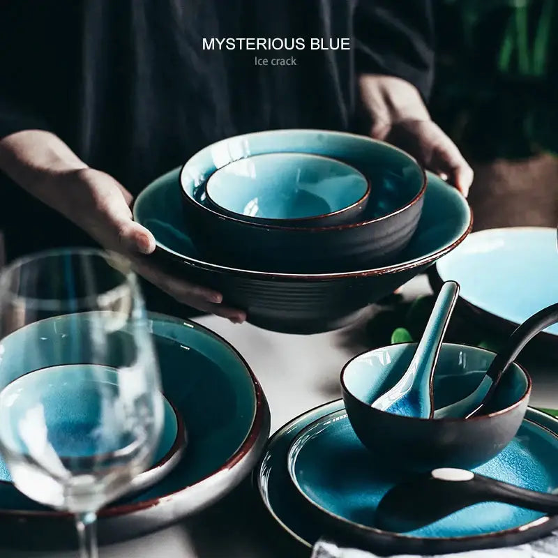 Mysterious blue ice crack ceramic tableware set with deep teal interiors and dark brown rims featuring ice cracking glaze