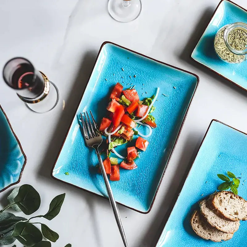 Vibrant turquoise ceramic tableware set plate with ice cracking glaze and dark brown rim for elegant dining room use