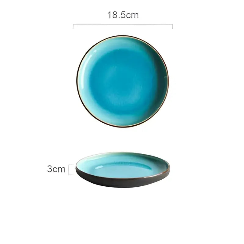 A turquoise ice cracking glaze ceramic plate with dark brown rim in a tableware set for dining room use
