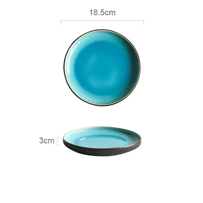 A turquoise ice cracking glaze ceramic plate with dark brown rim in a tableware set for dining room use
