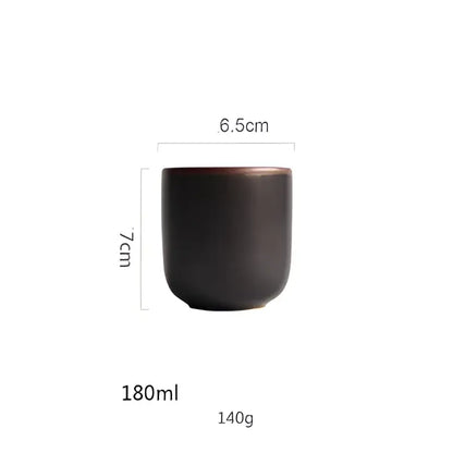 A sleek dark brown ceramic teacup with matte finish and rounded edges in a turquoise ice cracking glaze tableware set