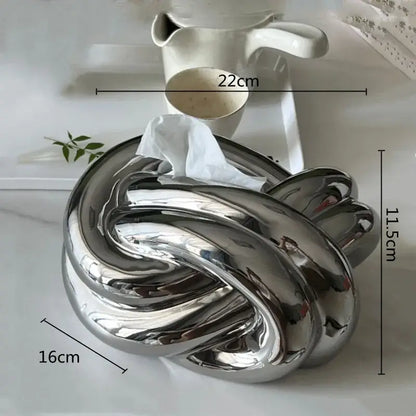 Shiny silver ceramic desktop storage paper tissue box holder in a twisted knot design for living room decorbites ceramic desktop