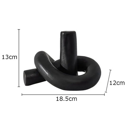 Black ceramic candle holder with sleek twisted knot design for decorbites ceramic desktop storage and desktop storage paper use