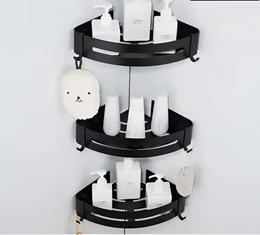 Black aluminum bathroom two tier corner shelf with sleek curved shelves and hooks for organized storage by decorbites