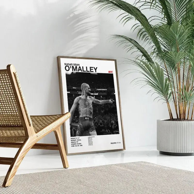 A framed black and white ufc canvas print of fighter sugar sean o’malley with name and stats for gym decor
