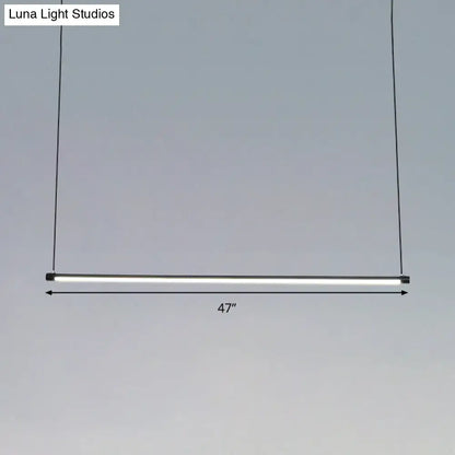 47-inch ultra slim tube led office hanging lamp in black with warm white light and minimalist cylindrical design for dining rooms