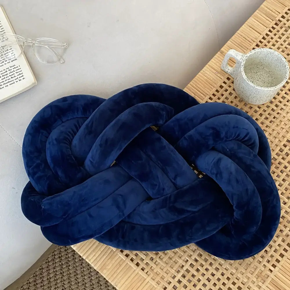 Deep blue velvet knot throw pillow made of soft velvet for living room decorative use