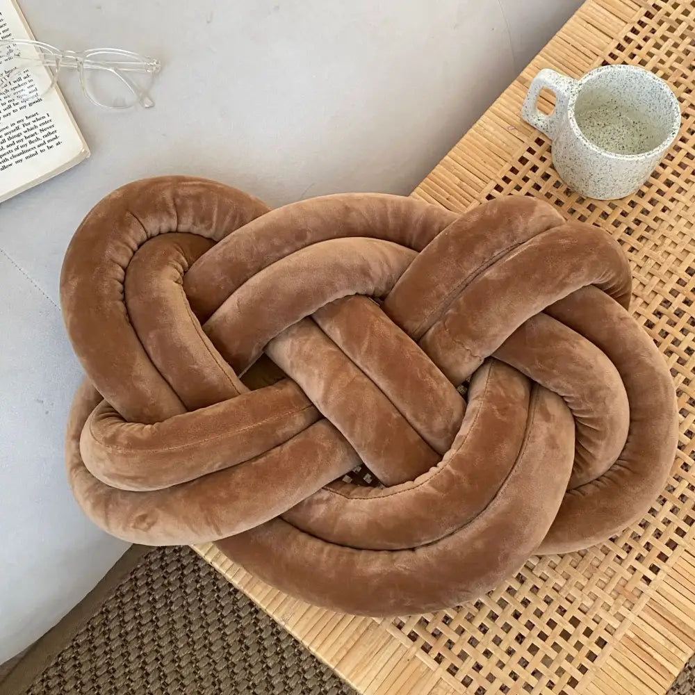 Plush tan velvet knot throw pillow with soft velour texture decorative cushion for living room decor